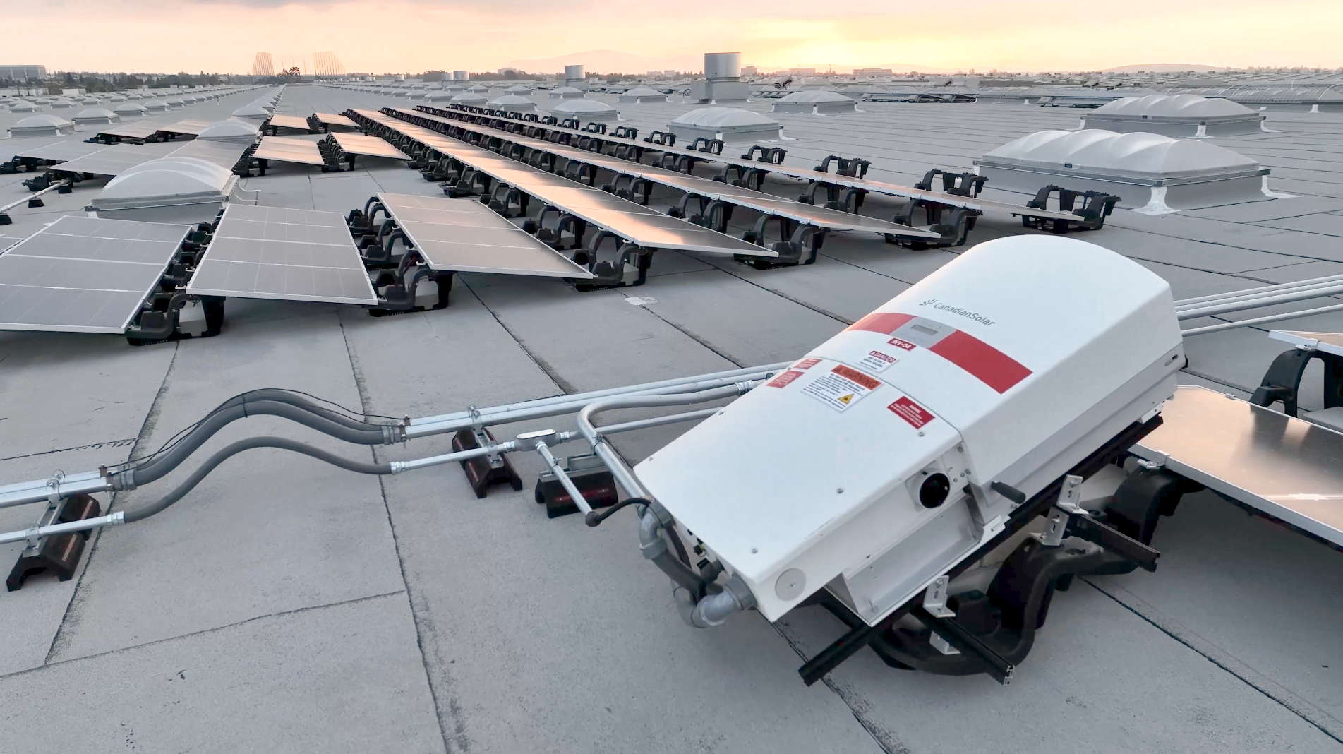 Solar panel installation on commercial building roof with convertor