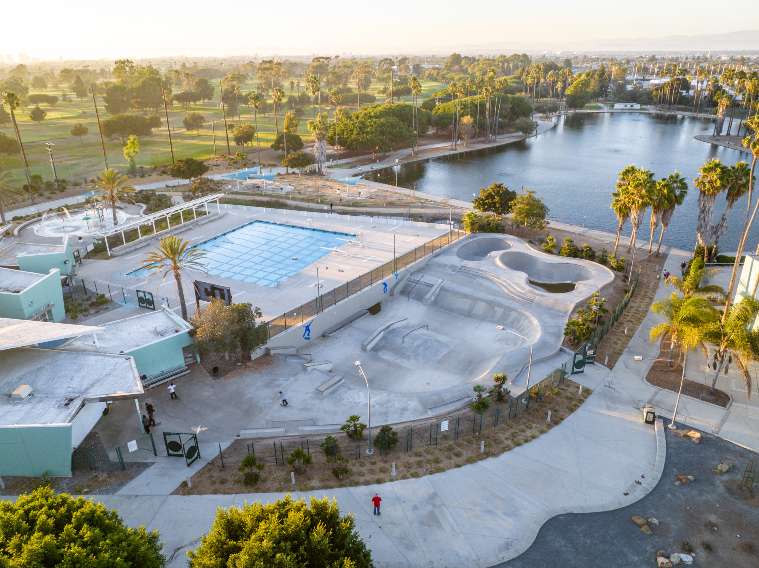 Alondra Park Splash Pad. Outdoor public playground with swings, climbing equipment & a kid-friendly fountain.